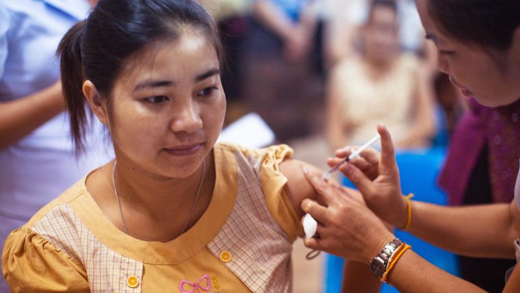Young person receiving a vaccination.